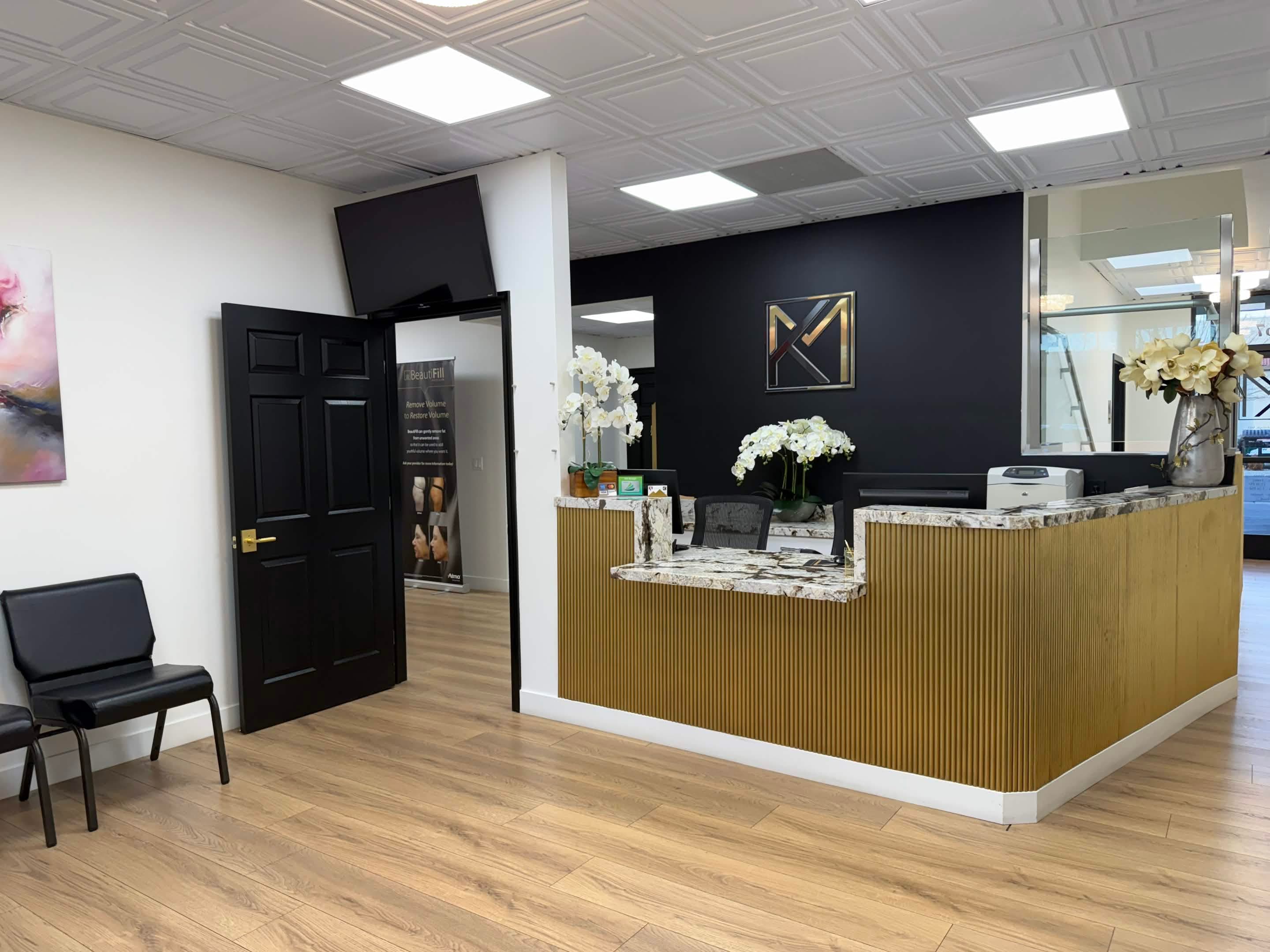 Reception desk and front office area with seating near the entry.